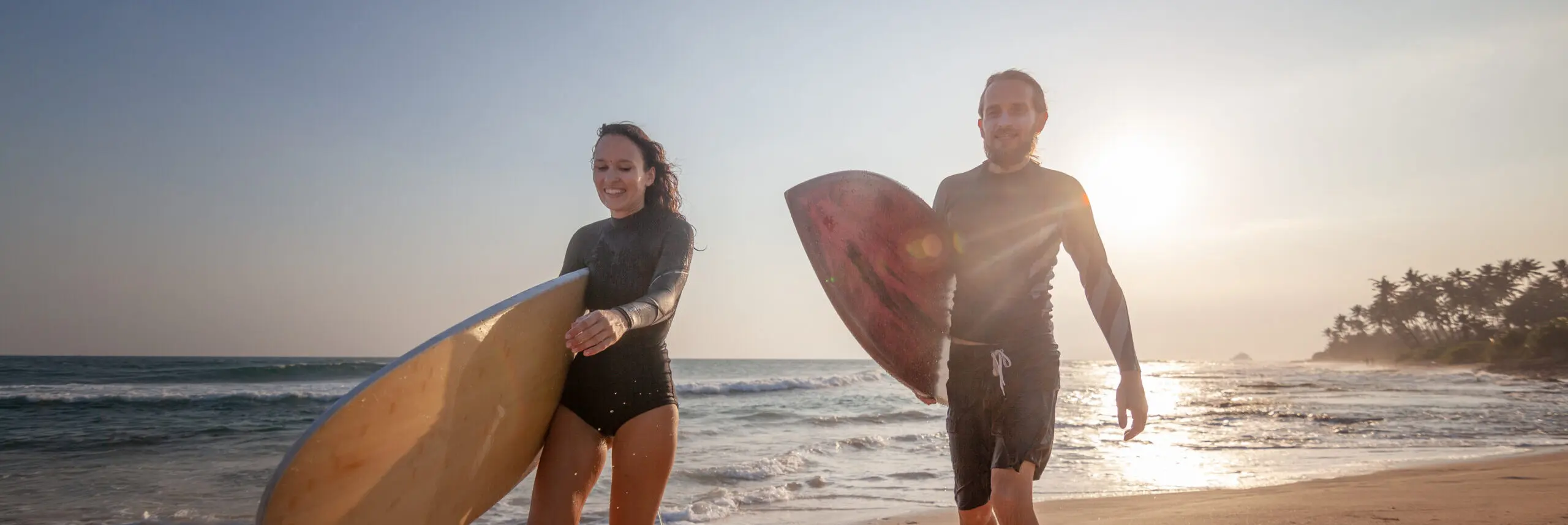 photo-sspt-surfers-on-beach-scaled-e1639516667965.webp